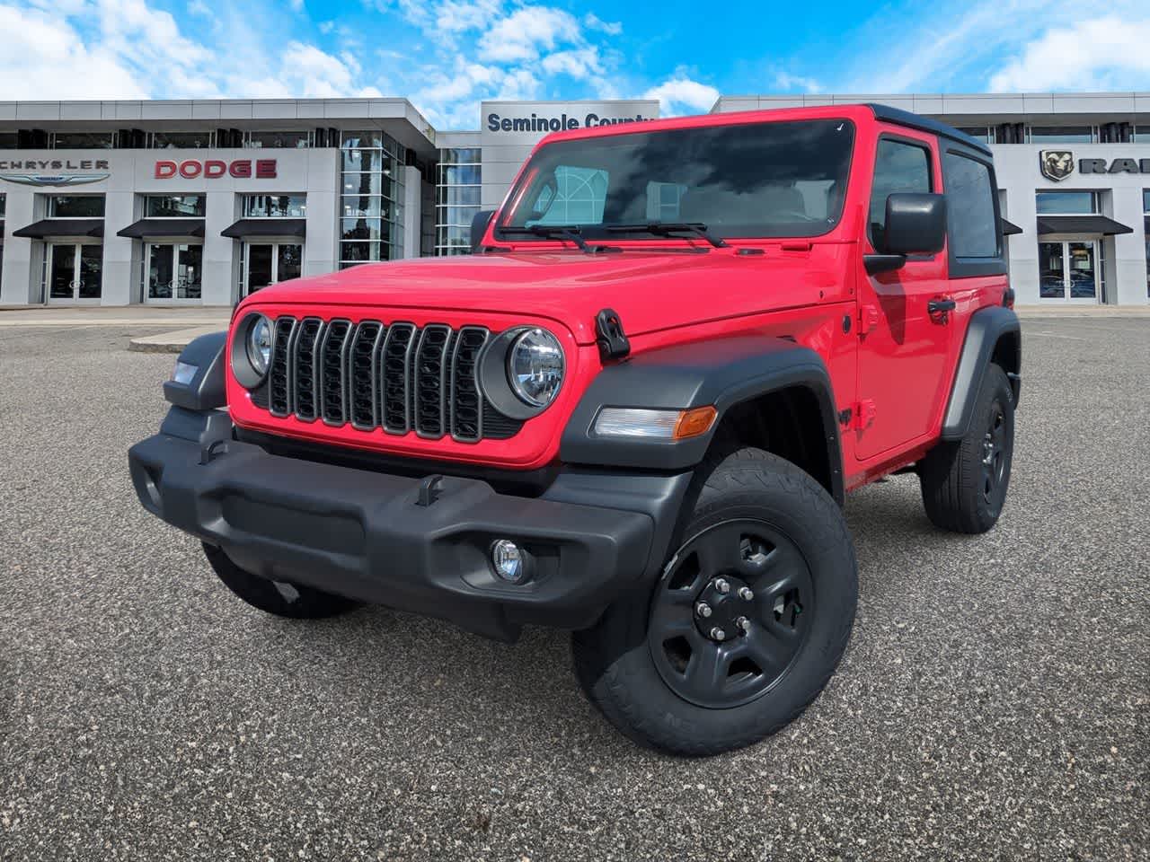 2026 Jeep Wrangler WRANGLER 2-DOOR SPORT in Firecracker Red Clear-Coat Exterior Paint — front three-quarter view