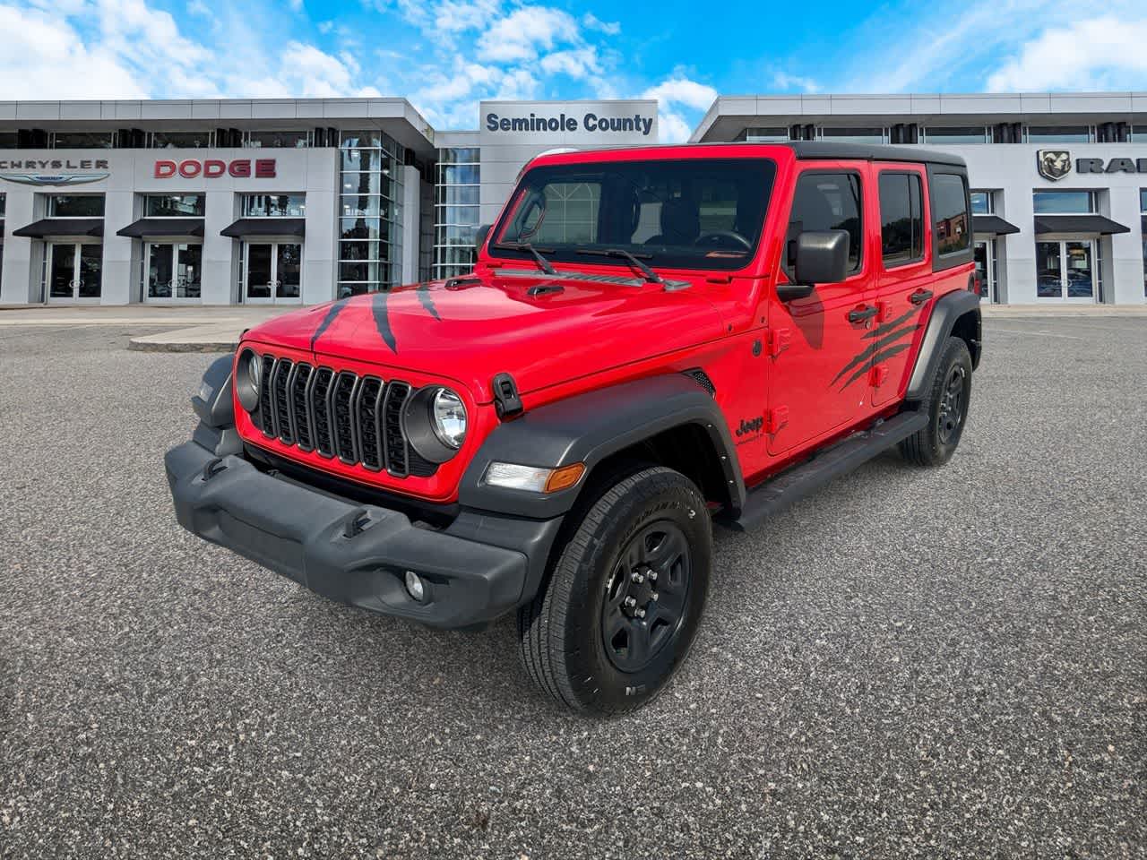 2024 Jeep Wrangler 4-Door Sport 4x4 in Firecracker Red Clearcoat — front three-quarter view