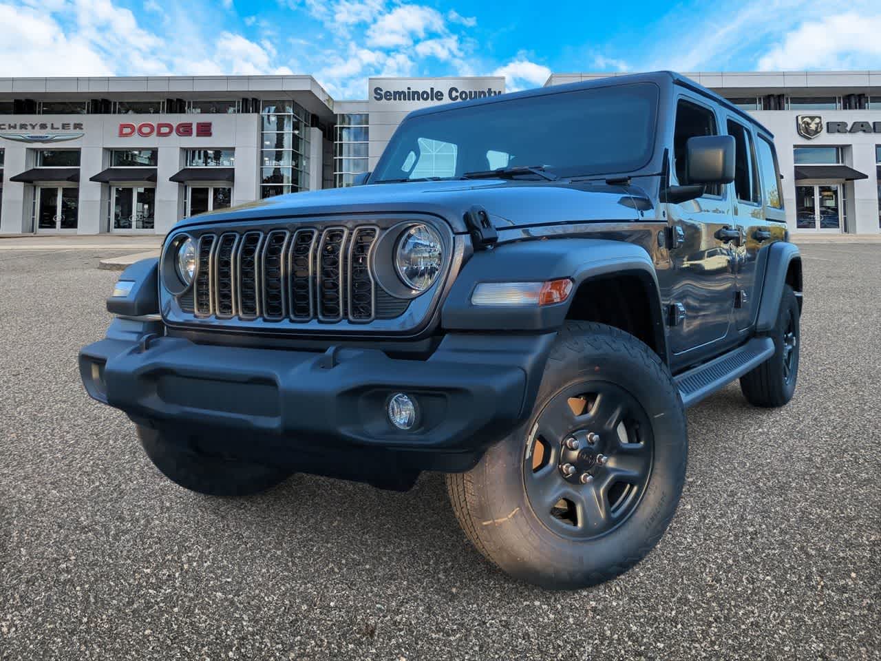 2026 Jeep Wrangler WRANGLER 4-DOOR SPORT in Granite Crystal Metallic Clear-Coat Exterior Paint — front three-quarter view