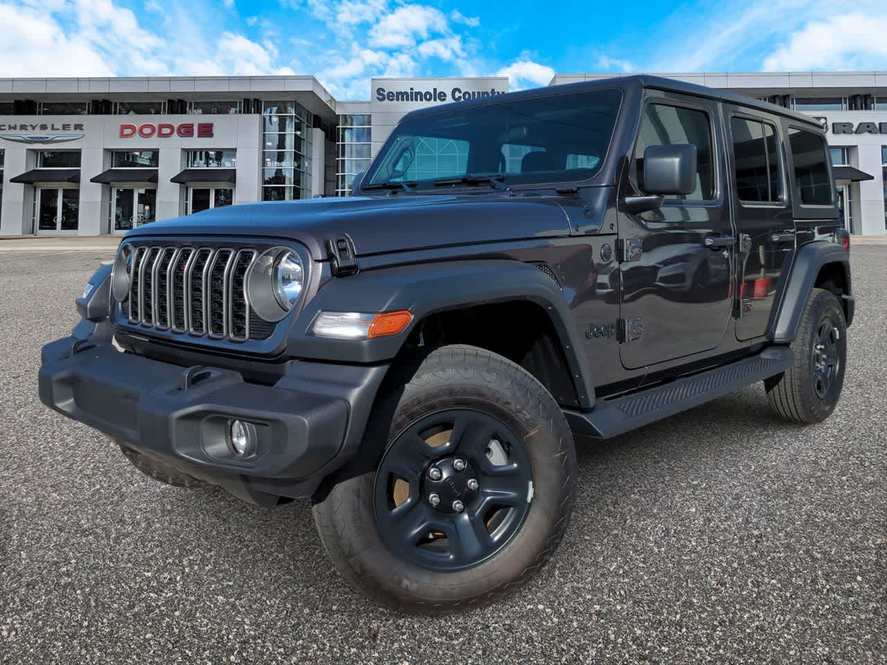 2026 Jeep Wrangler WRANGLER 4-DOOR SPORT in Granite Crystal Metallic Clear-Coat Exterior Paint — front three-quarter view