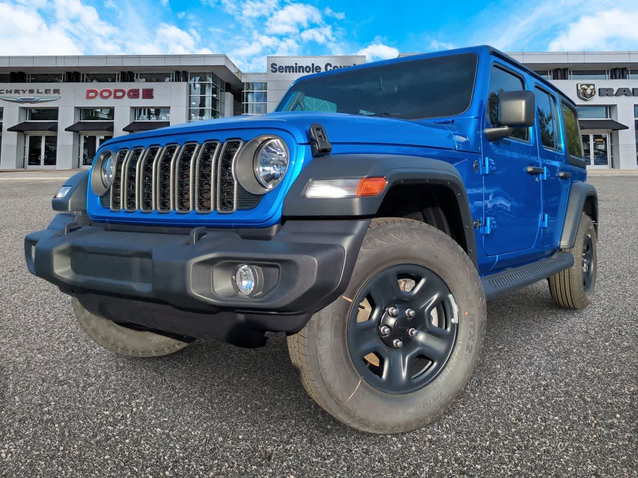 2026 Jeep Wrangler WRANGLER 4-DOOR SPORT in Hydro Blue Pearl-Coat Exterior Paint — front three-quarter view