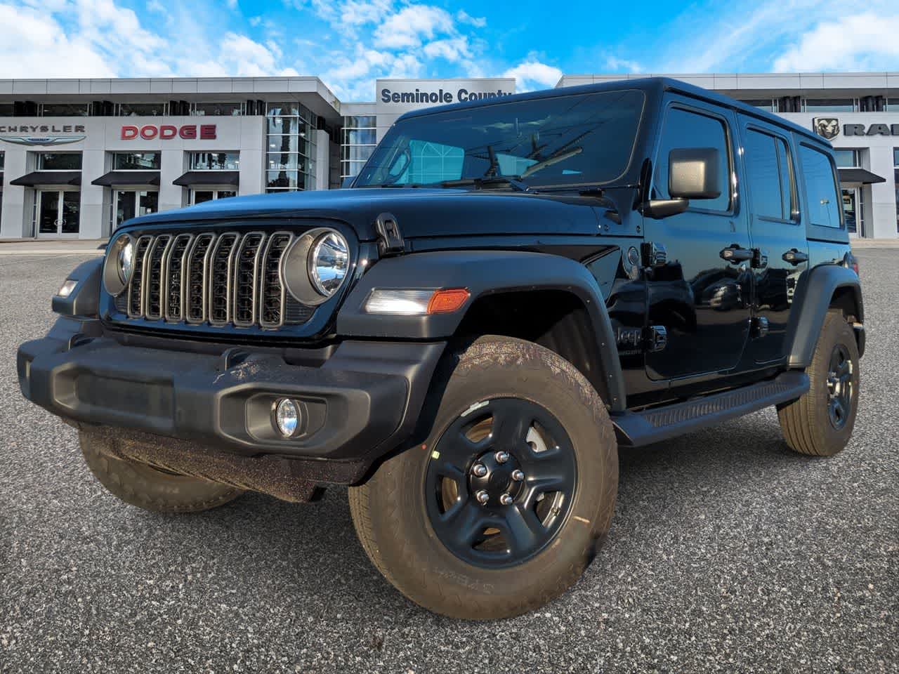 2026 Jeep Wrangler WRANGLER 4-DOOR SPORT in Black Clear-Coat Exterior Paint — front three-quarter view