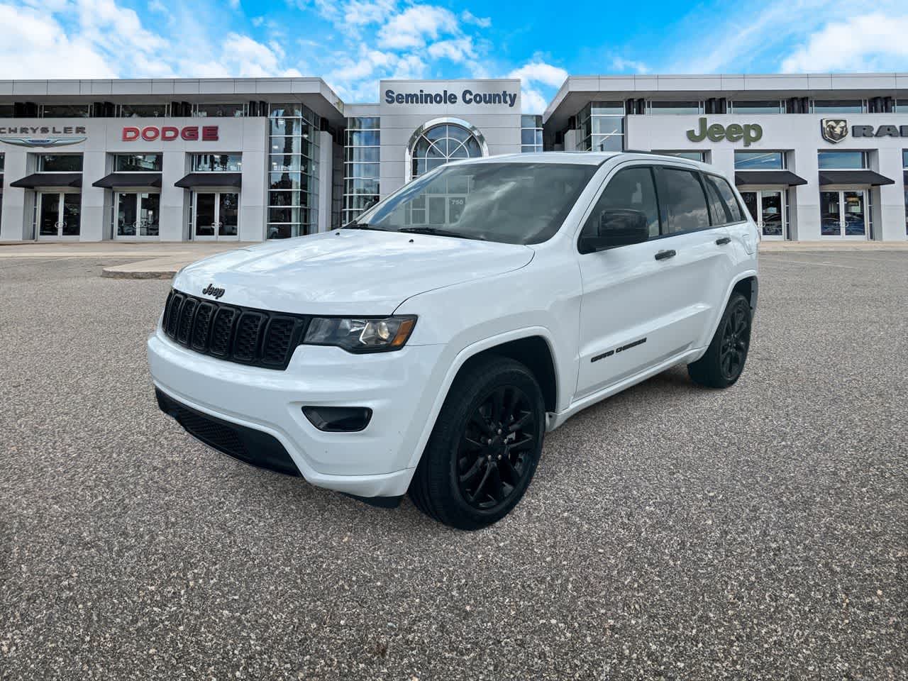 2021 Jeep Grand Cherokee Laredo X 4x4 in Bright White Clearcoat — front three-quarter view
