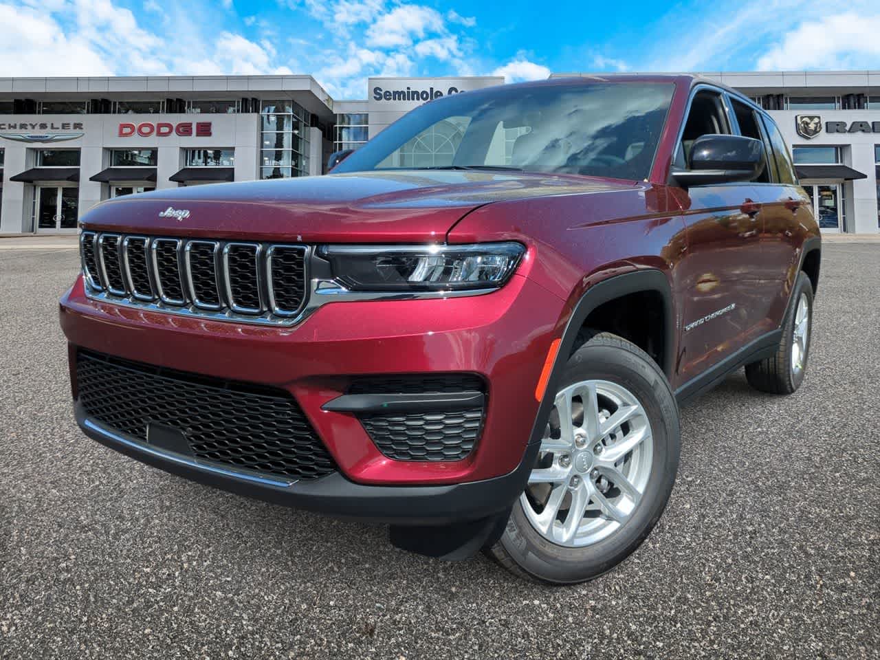 2026 Jeep Grand Cherokee GRAND CHEROKEE LAREDO X 4X4 in Velvet Red Pearl-Coat Exterior Paint — front three-quarter view