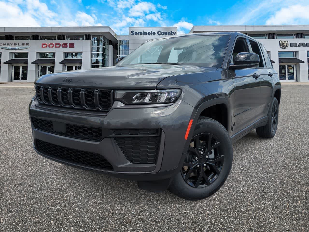 2026 Jeep Grand Cherokee GRAND CHEROKEE LAREDO ALTITUDE 4X4 in Baltic Gray Metallic Clear-Coat Exterior Paint — front three-quarter view