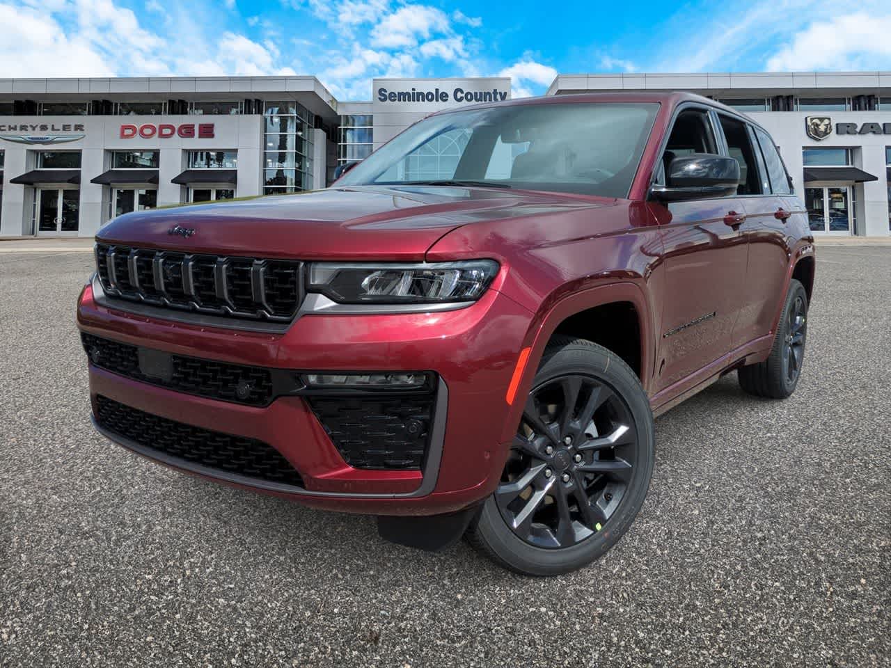 2026 Jeep Grand Cherokee GRAND CHEROKEE LIMITED RESERVE 4X4 in Velvet Red Pearl-Coat Exterior Paint — front three-quarter view