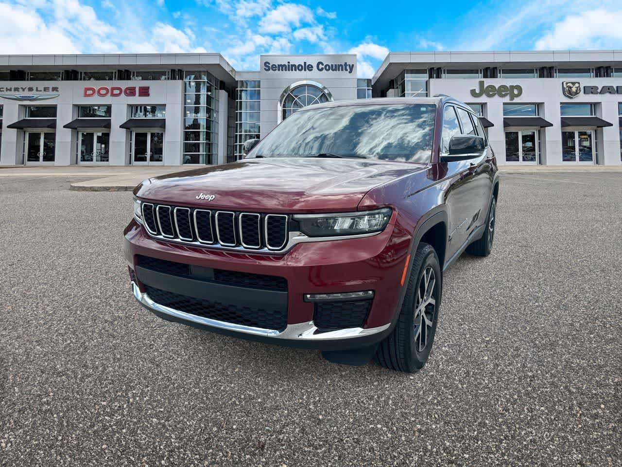 2023 Jeep Grand Cherokee L Limited 4x4 in Velvet Red Pearlcoat — front three-quarter view