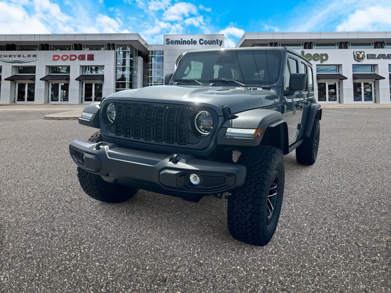 2026 Jeep Wrangler WRANGLER 4-DOOR WILLYS in Anvil Clear-Coat Exterior Paint — front three-quarter view