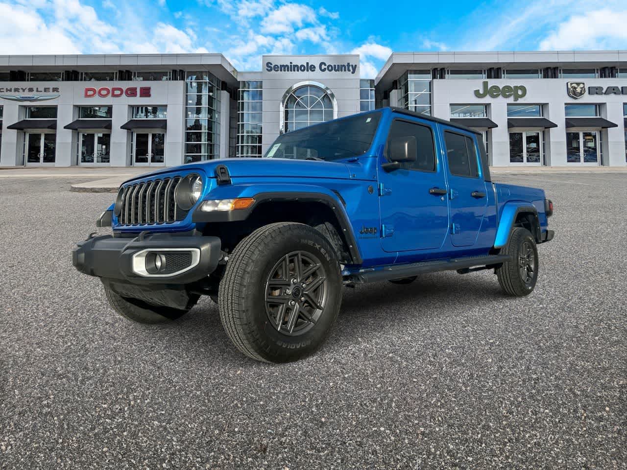 2024 Jeep Gladiator Sport S in Hydro Blue Pearlcoat — front three-quarter view