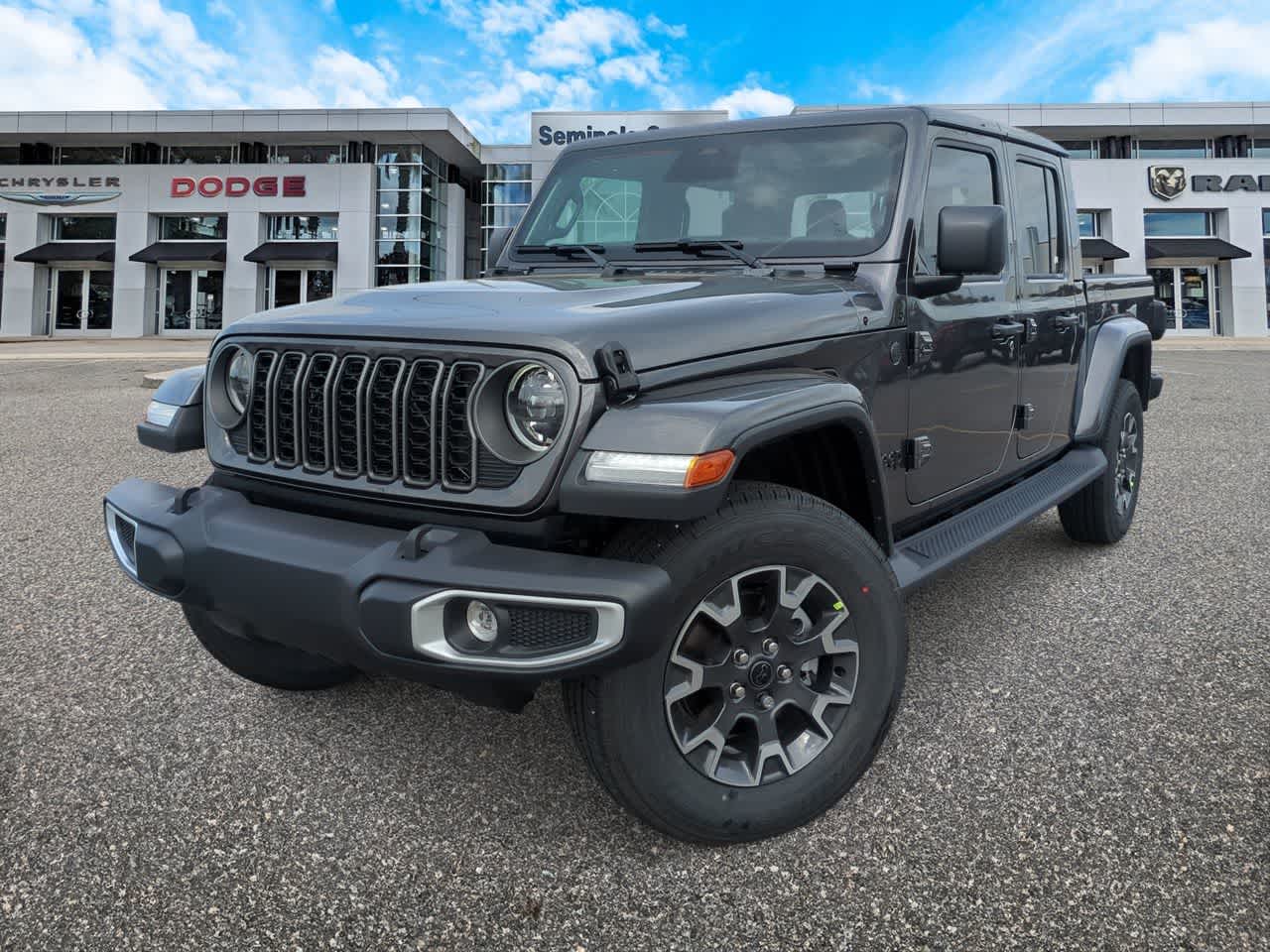 2026 Jeep Gladiator GLADIATOR SAHARA 4X4 in Granite Crystal Metallic Clearcoat — front three-quarter view