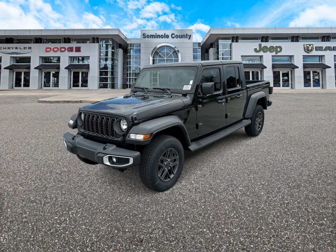 2026 Jeep Gladiator GLADIATOR SPORT 4X4 in Black Clear-Coat Exterior Paint — front three-quarter view