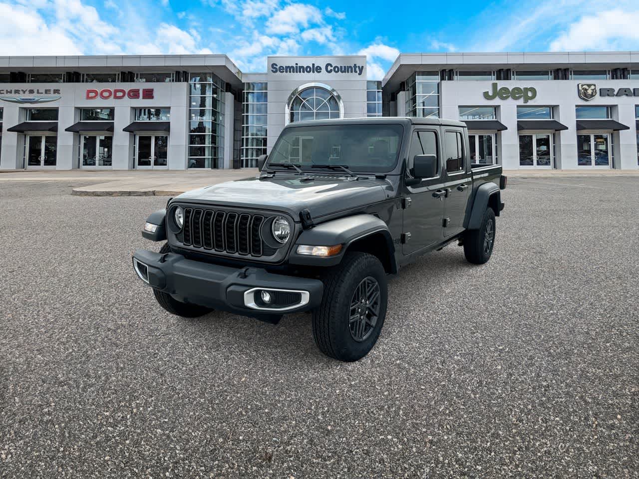 2026 Jeep Gladiator GLADIATOR SPORT 4X4 in Granite Crystal Metallic Clear-Coat Exterior Paint — front three-quarter view