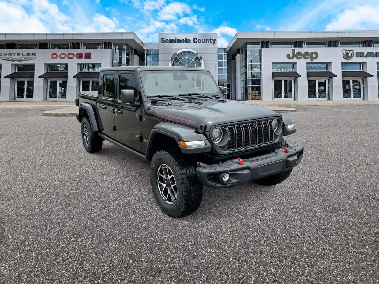 2026 Jeep Gladiator GLADIATOR RUBICON X 4X4 in Black Clear-Coat Exterior Paint — front three-quarter view