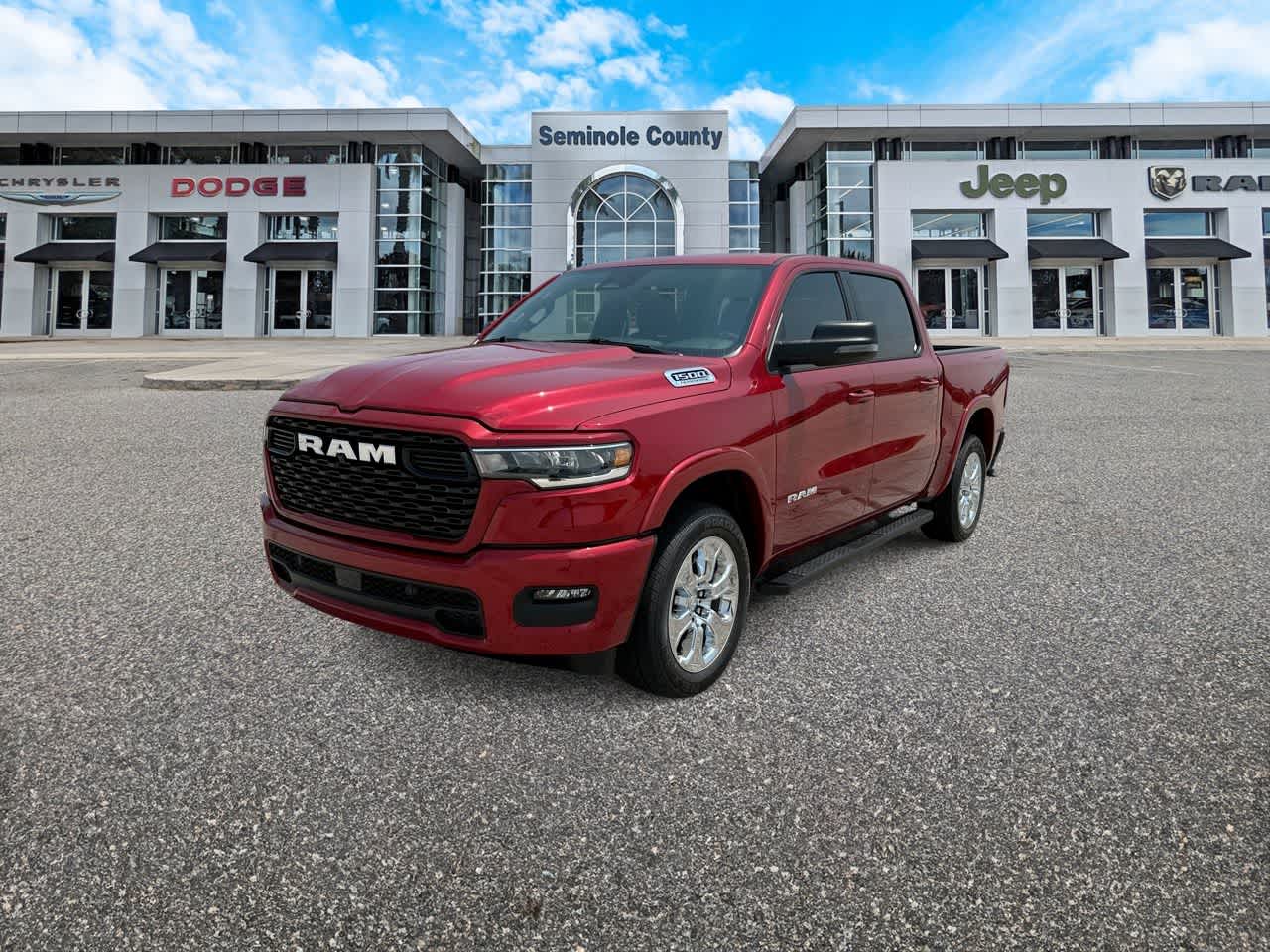 2026 RAM Ram 1500 RAM 1500 BIG HORN CREW CAB 4X4 5'7' BOX in Molten Red Pearl-Coat Exterior Paint — front three-quarter view