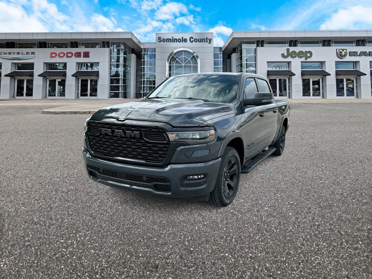2026 RAM 1500 Big Horn Crew Cab 4x4 5'7' Box in Forged Blue Metallic — front three-quarter view