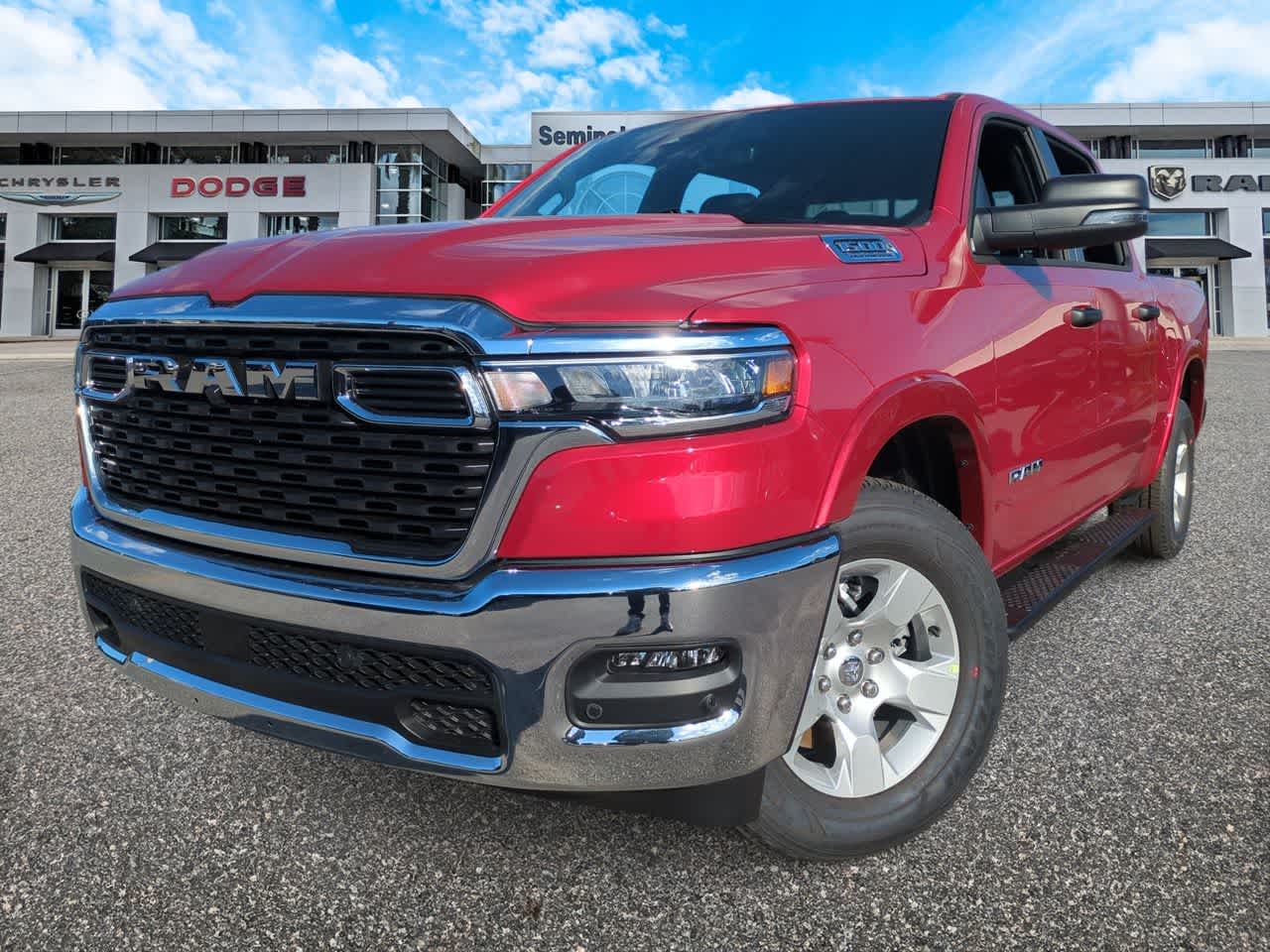 2026 RAM Ram 1500 RAM 1500 BIG HORN CREW CAB 4X4 5'7' BOX in Molten Red Pearl-Coat Exterior Paint — front three-quarter view