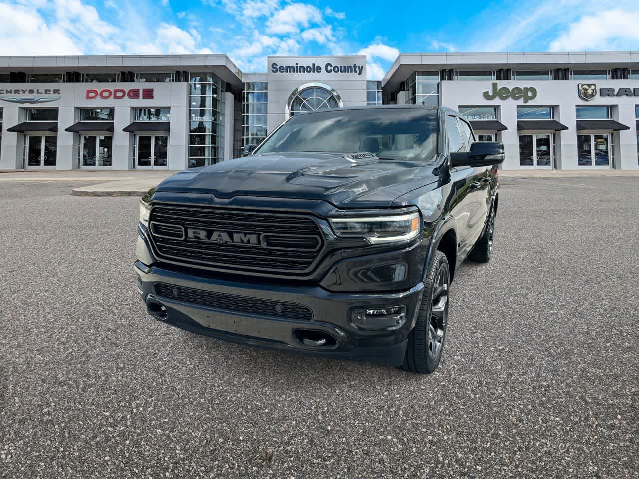 2023 RAM 1500 Limited Crew Cab 4x4 5'7' Box in Diamond Black Crystal Pearlcoat — front three-quarter view