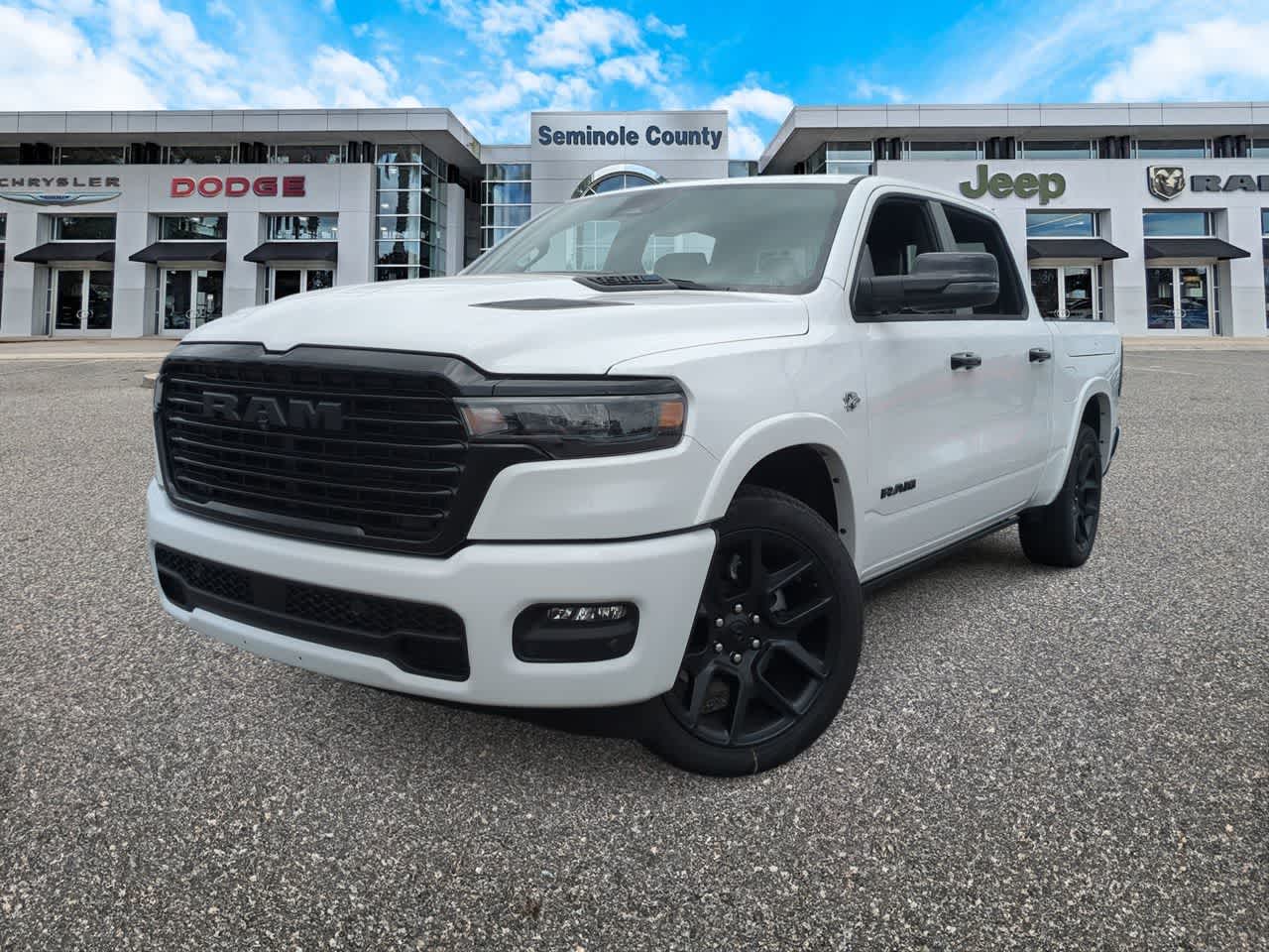2026 RAM Ram 1500 RAM 1500 LARAMIE CREW CAB 4X4 5'7' BOX in Bright White Clear-Coat Exterior Paint — front three-quarter view