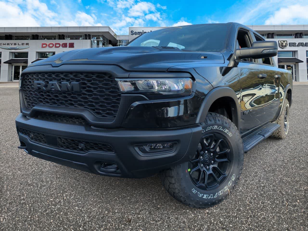 2026 RAM Ram 1500 RAM 1500 REBEL CREW CAB 4X4 5'7' BOX in Diamond Black Crystal Pearl-Coat Exterior Paint — front three-quarter view