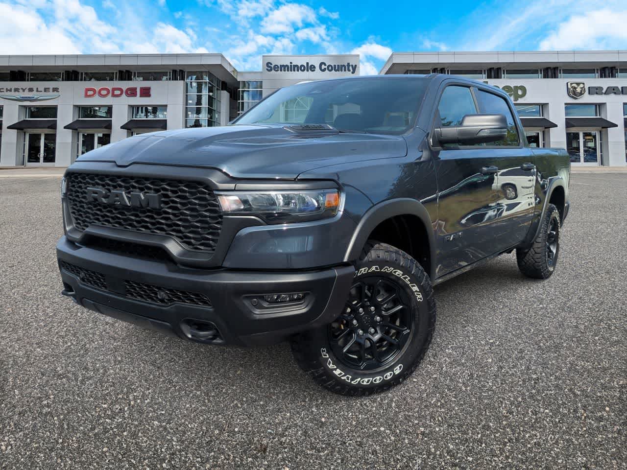 2026 RAM 1500 Rebel Crew Cab 4x4 5'7' Box in Forged Blue Metallic — front three-quarter view