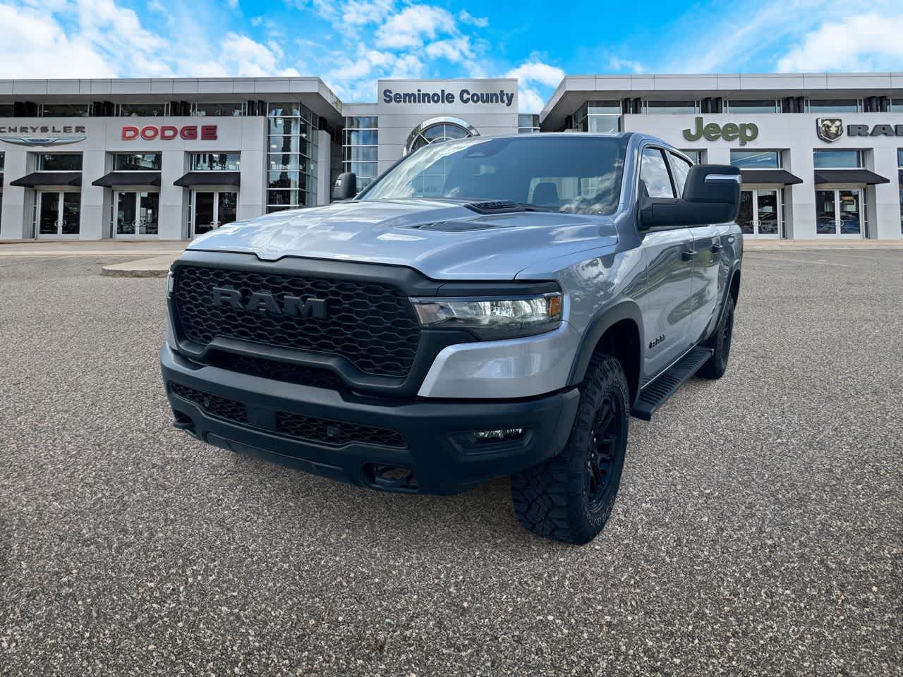 2025 RAM 1500 Rebel Crew Cab 4x4 5'7' Box in Billet Silver Metallic Clearcoat — front three-quarter view