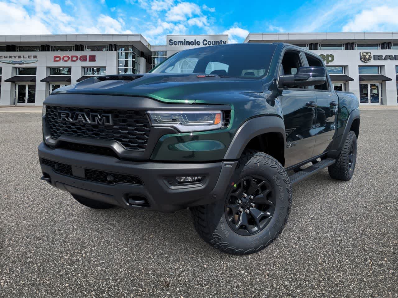 2026 RAM Ram 1500 RAM 1500 RHO CREW CAB 4X4 5'7' BOX in Serrano-Green Metallic Exterior Paint — front three-quarter view