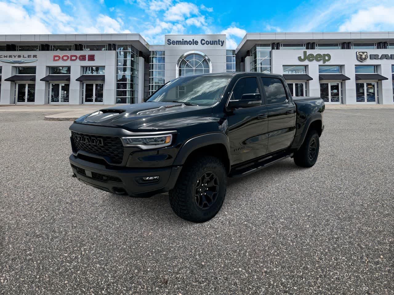 2026 RAM Ram 1500 RAM 1500 RHO CREW CAB 4X4 5'7' BOX in Diamond Black Crystal Pearl-Coat Exterior Paint — front three-quarter view
