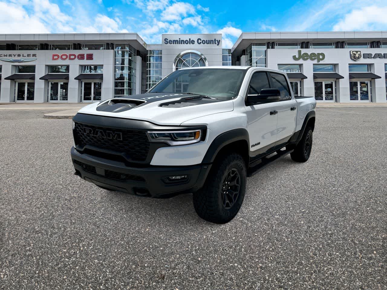 2026 RAM Ram 1500 RAM 1500 RHO CREW CAB 4X4 5'7' BOX in Bright White Clear-Coat Exterior Paint — front three-quarter view