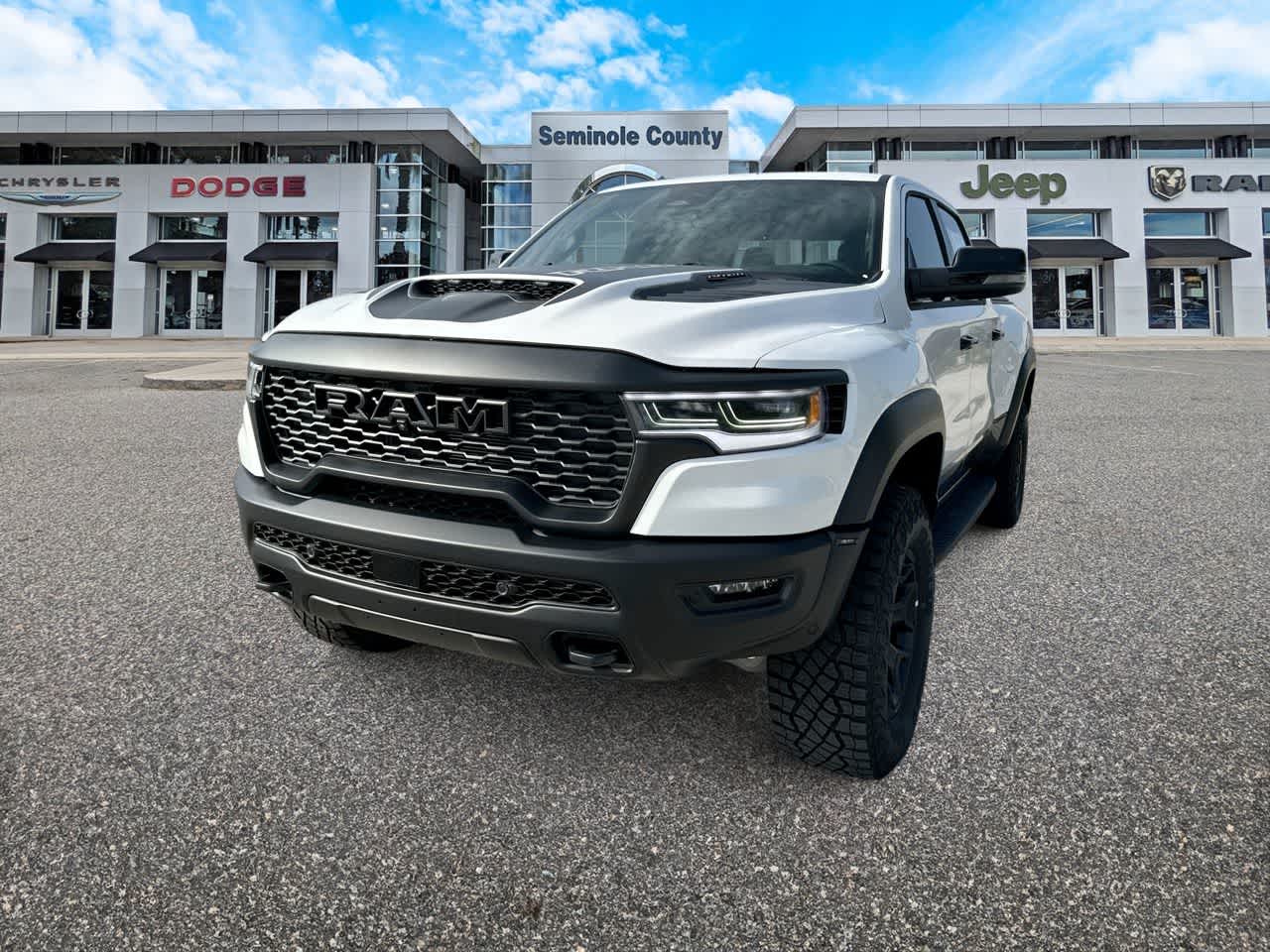 2026 RAM Ram 1500 RAM 1500 RHO CREW CAB 4X4 5'7' BOX in Bright White Clear-Coat Exterior Paint — front three-quarter view