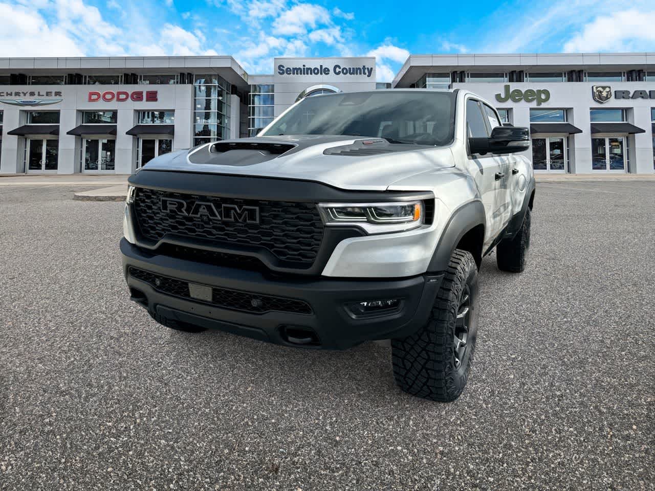 2026 RAM Ram 1500 RAM 1500 RHO CREW CAB 4X4 5'7' BOX in Silver Zynith Exterior Paint — front three-quarter view