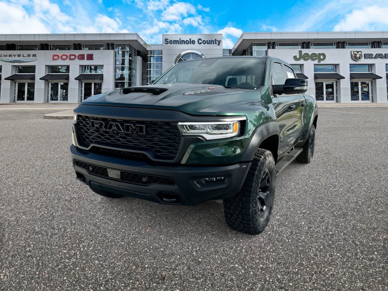 2026 RAM Ram 1500 RAM 1500 RHO CREW CAB 4X4 5'7' BOX in Serrano-Green Metallic Exterior Paint — front three-quarter view