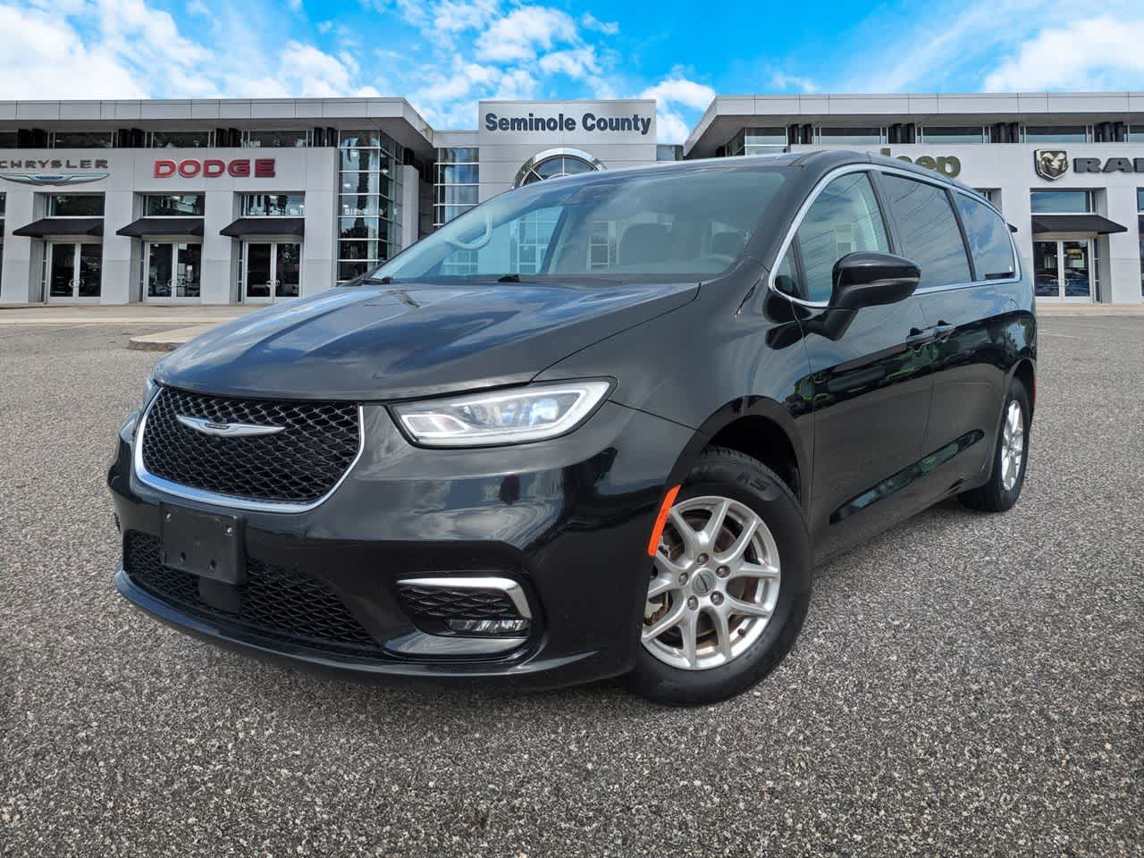 2023 Chrysler Pacifica Touring L in Brilliant Black Crystal Pearlcoat — front three-quarter view