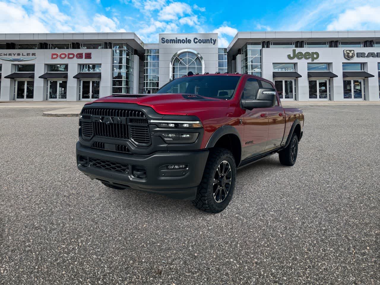 2026 RAM Ram 2500 RAM 2500 REBEL CREW CAB 4X4 6'4' BOX in Molten Red Pearl-Coat Exterior Paint — front three-quarter view