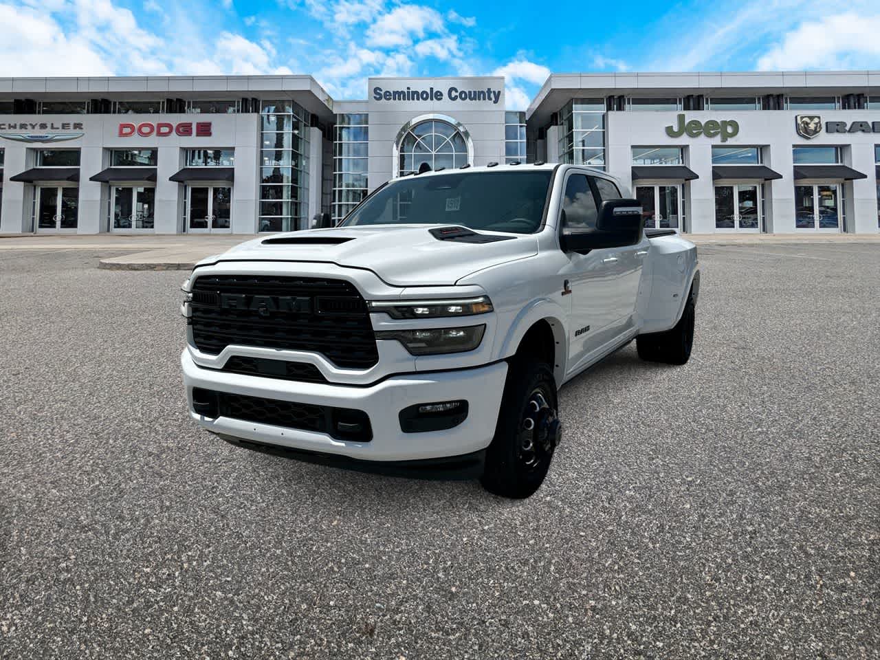 2026 RAM Ram 3500 RAM 3500 LIMITED MEGA CAB 4X4 6'4' BOX in Bright White Clear-Coat Exterior Paint — front three-quarter view