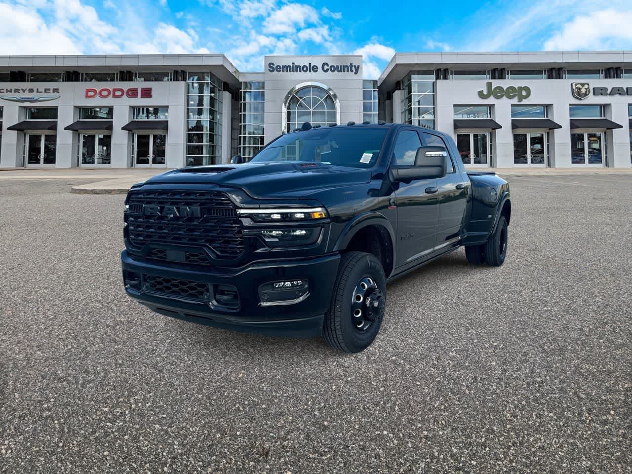 2026 RAM Ram 3500 RAM 3500 LIMITED MEGA CAB 4X4 6'4' BOX in Diamond Black Crystal Pearl-Coat Exterior Paint — front three-quarter view