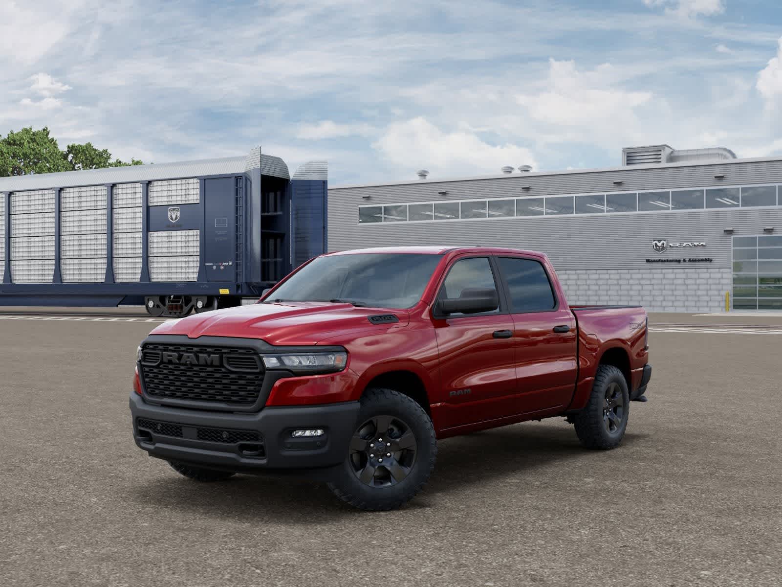 2026 RAM Ram 1500 RAM 1500 WARLOCK CREW CAB 4X4 5'7' BOX in Molten Red Pearl-Coat Exterior Paint — front three-quarter view