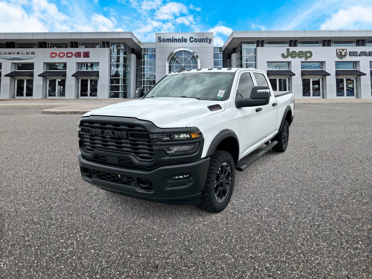 2026 RAM Ram 2500 RAM 2500 WARLOCK CREW CAB 4X4 6'4' BOX in Bright White Clear-Coat Exterior Paint — front three-quarter view