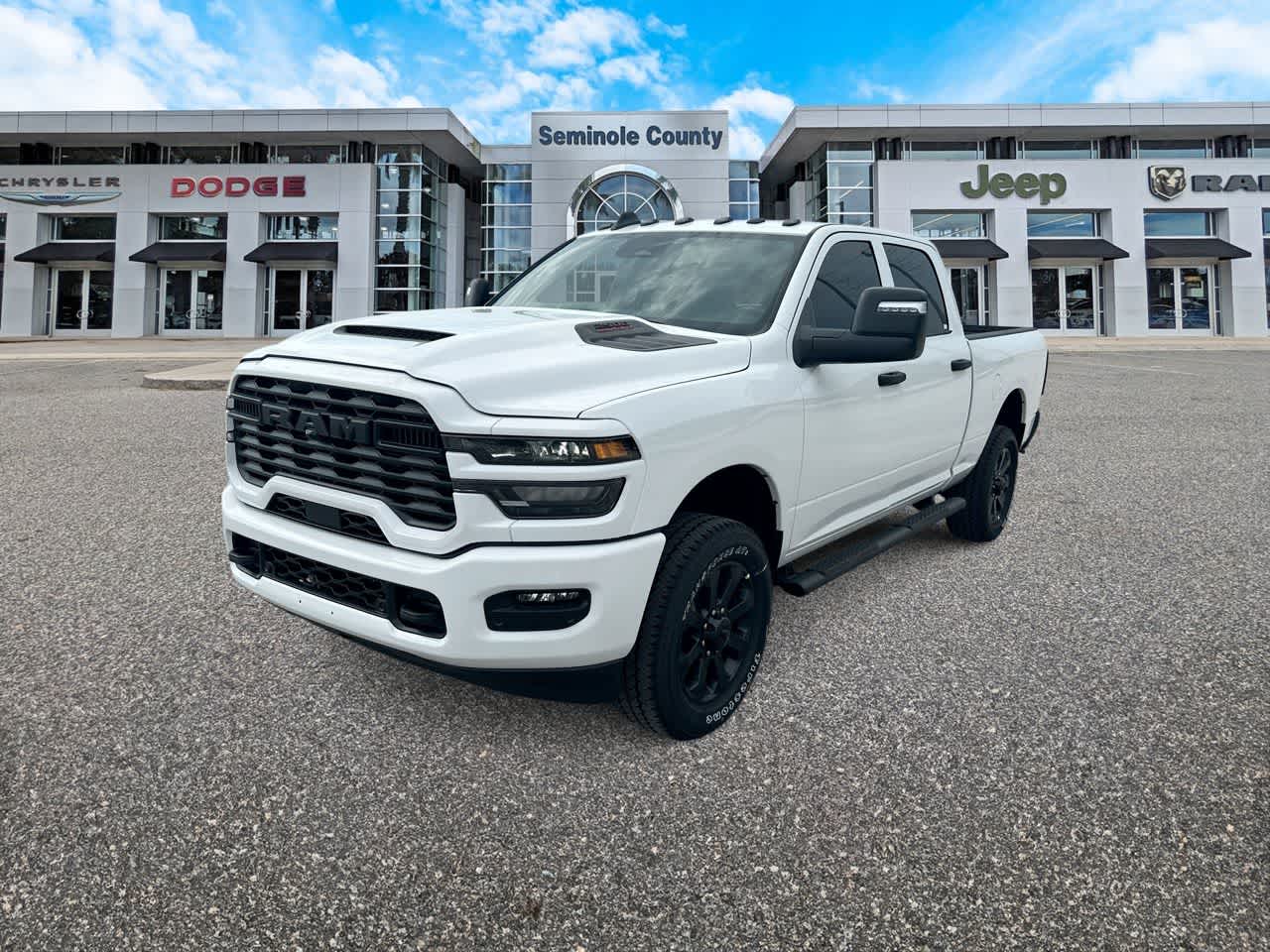 2026 RAM Ram 2500 RAM 2500 BLACK EXPRESS CREW CAB 4X4 6'4' BOX in Bright White Clear-Coat Exterior Paint — front three-quarter view