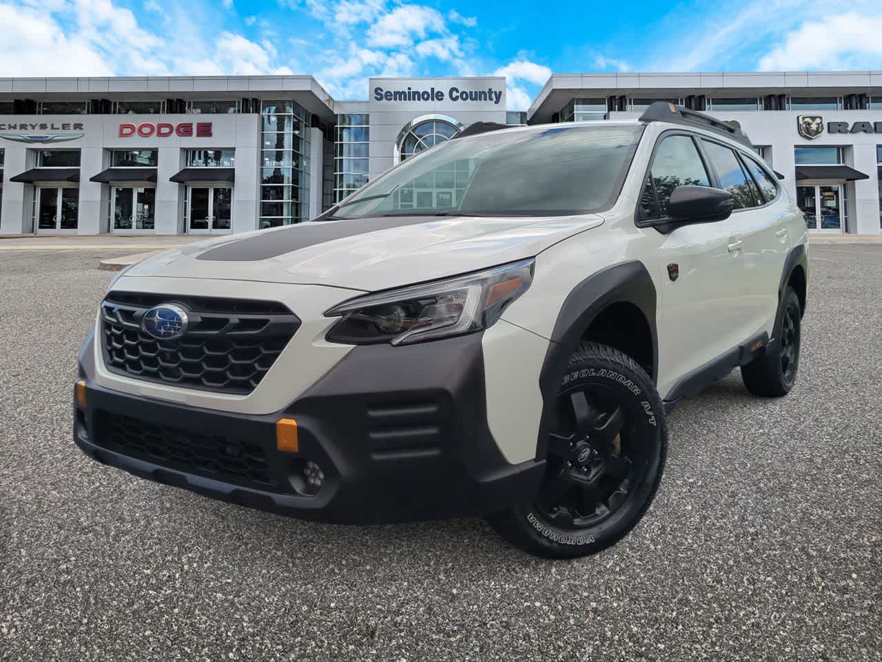 2023 Subaru Outback Wilderness in Crystal White Pearl — front three-quarter view