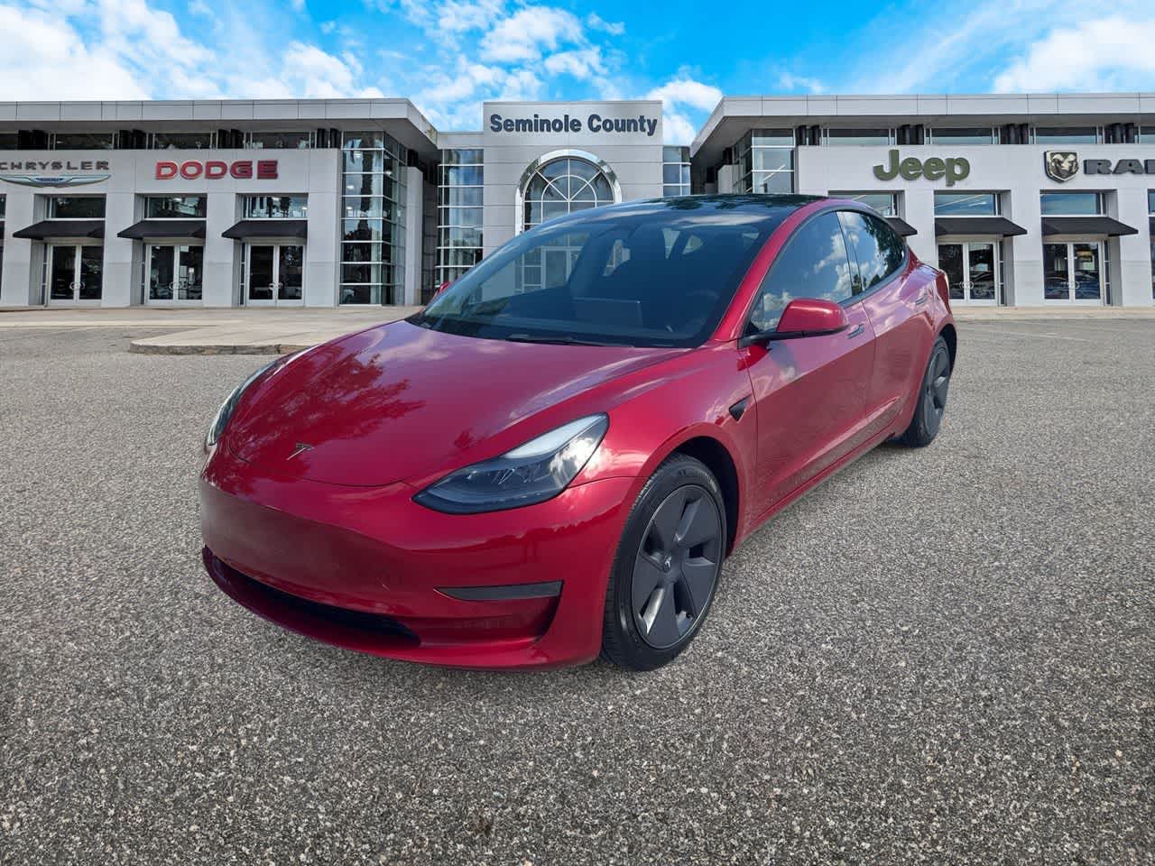 2022 Tesla Model 3 Rear-Wheel Drive in Red — front three-quarter view